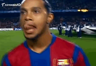Man in Soccer Uniform Making Funny Face on Soccer Field