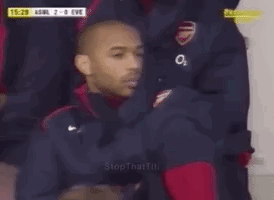 Man in Soccer Uniform Sitting in Stands