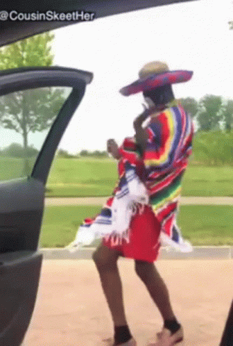 Man in Sombrero and Poncho Dancing