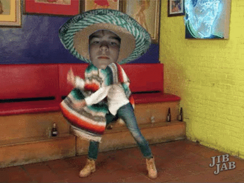 Man in Sombrero and Poncho Dancing