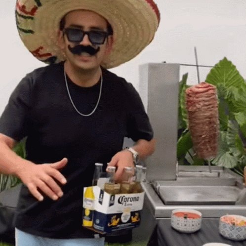 Man in Sombrero and Sunglasses Holding Corona