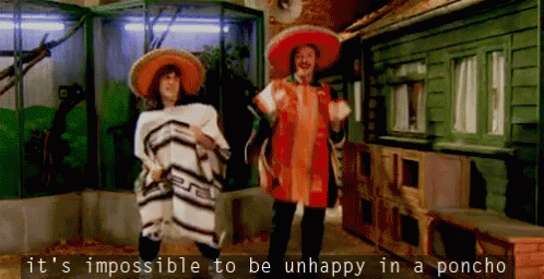 Man in Sombrero and Woman in Poncho Dancing