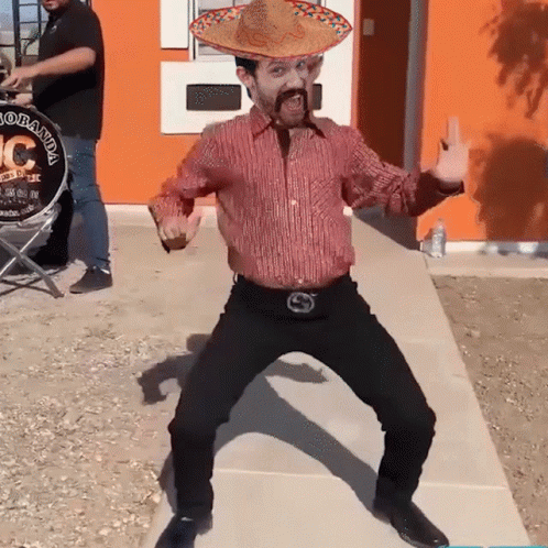 Man in Sombrero Dancing Near Drum Saying Colorada