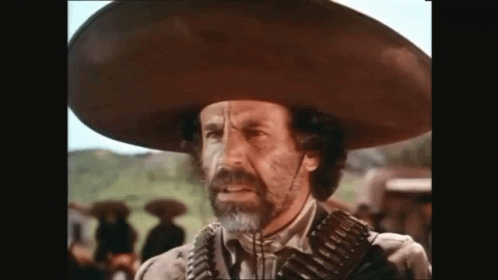 Man in Sombrero Holding Gun