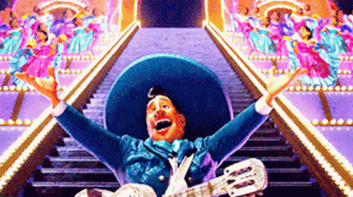 Man in Sombrero Playing Guitar in Front of Stairs
