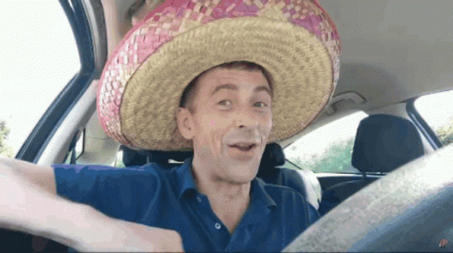 Man in Sombrero Sitting in Car