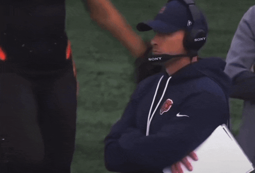 Man In Sony Headset On Football Field GIF