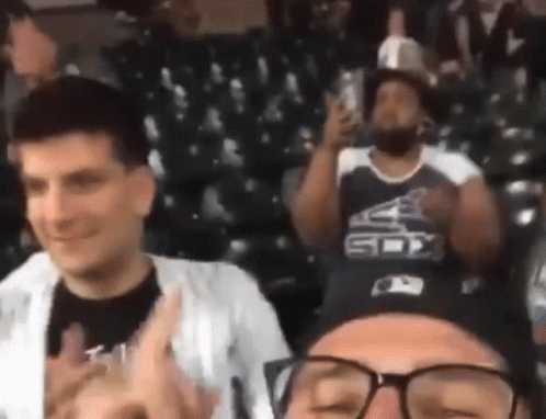 Man in Sox Jersey Sitting in Stadium