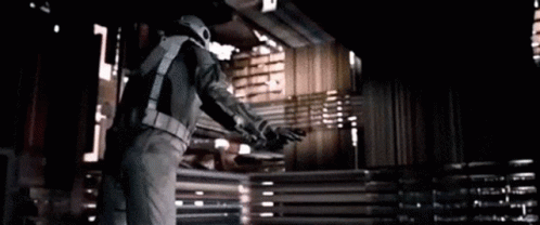 Man In Space Suit By Curtain GIF