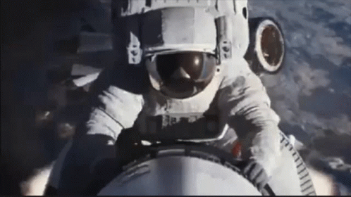 Man In Space Suit Riding Rocket GIF