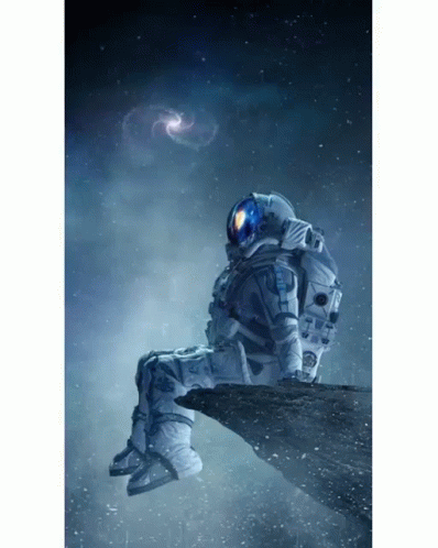 Man in Space Suit Sitting in Chair