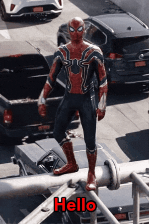 Man in Spider-Man Costume Standing on Pipe