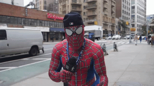 Man in Spiderman Costume Holding Microphone