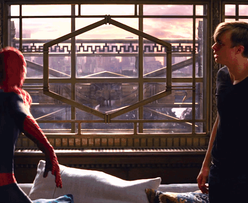 Man In Spiderman Costume In Front Of Large Window GIF