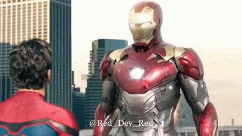 Man in Spiderman Costume Next to Iron Man