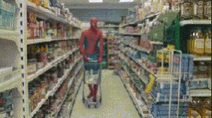 Man In Spiderman Costume Pushing Shopping Cart GIF