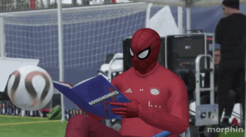 Man in Spiderman Costume Reading Bossonomics
