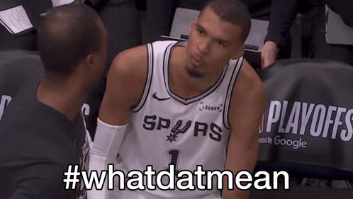 Man in Spurs Jersey Sitting in Stands