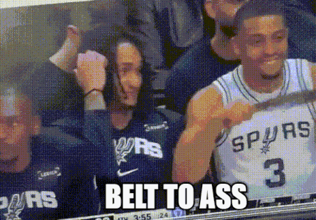 Man in Spurs Jersey Watching Game