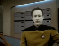 Man in Star Trek Uniform Holding Chest