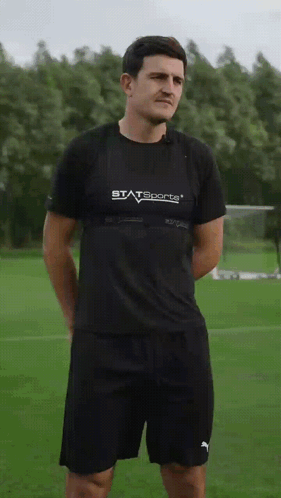 Man in Statsports Shirt on Field