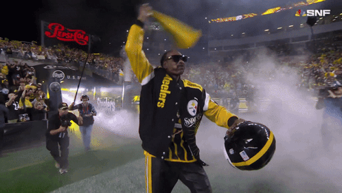 Man In Steelers Jacket Holding Helmet GIF