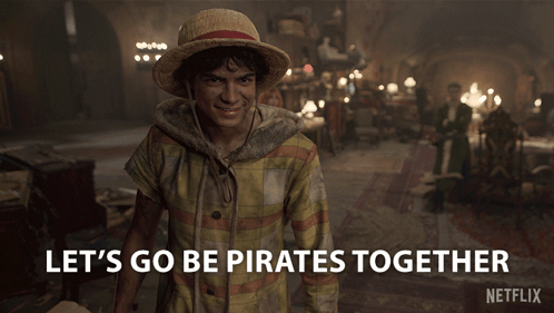 Man in Straw Hat Saying Lets Go Be Pirates