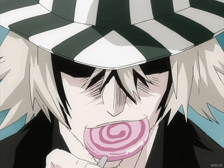Man in Striped Hat Eating Lollipop