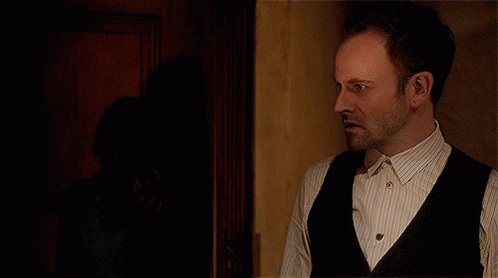 Man In Striped Shirt And Black Vest GIF