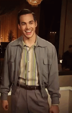 Man in Striped Shirt and Jacket Smiling