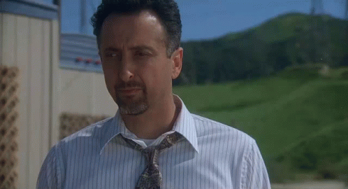 Man In Striped Shirt And Tie Outside GIF