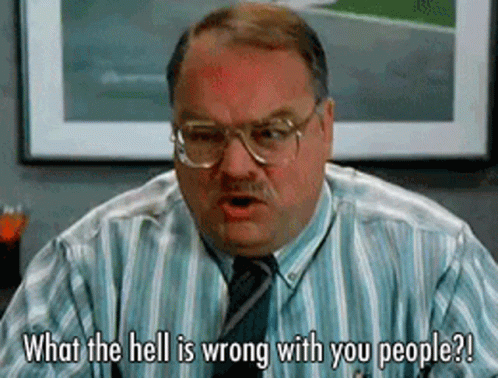 Man in Striped Shirt and Tie Talking