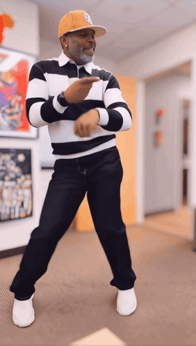Man In Striped Shirt And Yellow Hat Dancing GIF