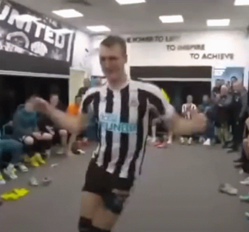 Man in Striped Shirt Dancing