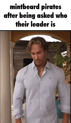 Man In Striped Shirt In Hallway GIF