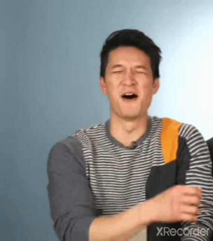 Man in Striped Shirt Laughing Eyes Closed