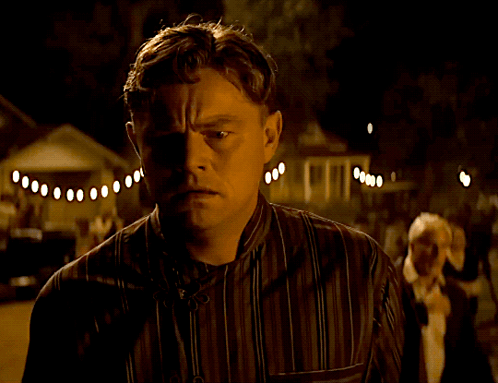 Man In Striped Shirt Looking GIF