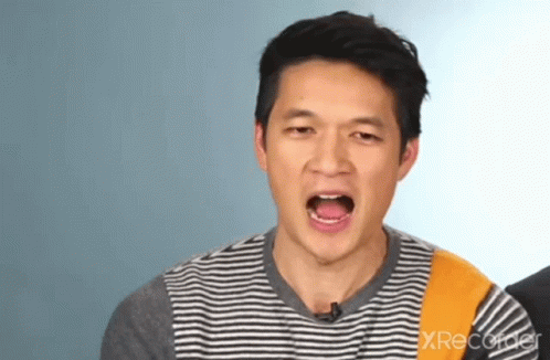 Man in Striped Shirt Making Funny Face