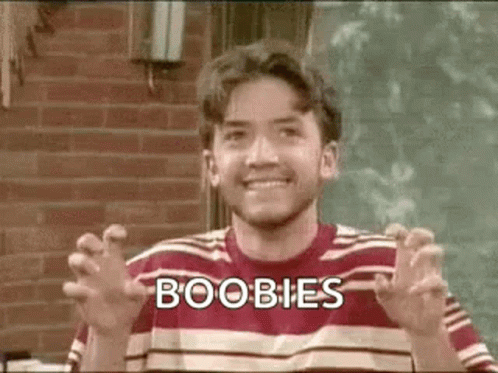 Man in Striped Shirt Making Funny Face Saying Boobs