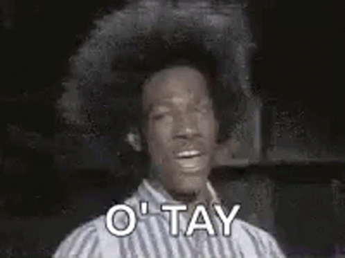 Man In Striped Shirt Making OK Sign GIF