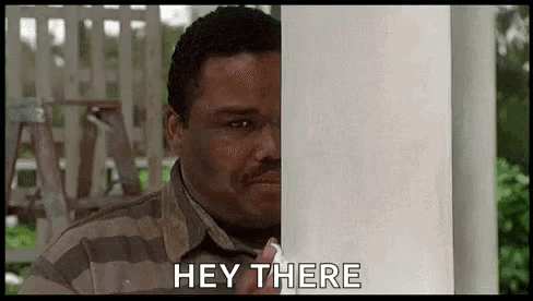 Man in Striped Shirt Peeking Saying Hey