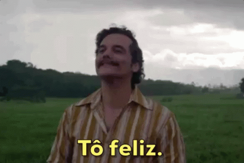 Man in Striped Shirt Saying Feliz