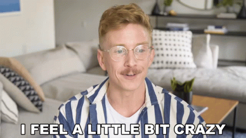 Man In Striped Shirt Saying I Feel Crazy GIF