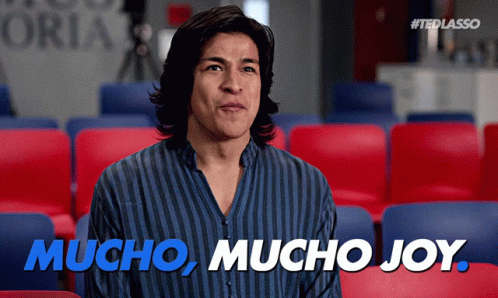 Man in Striped Shirt Saying Mucho Mucho Joy