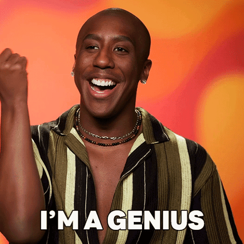 Man In Striped Shirt Says I'm A Genius Fist In Air GIF