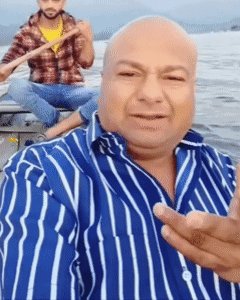 Man in Striped Shirt Taking Selfie With Another Man in Boat