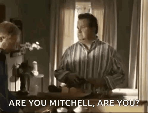 Man In Striped Shirt Talking To Another Man GIF
