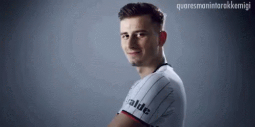 Man in Striped Shirt With Valde Smiling