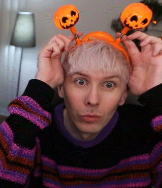Man in Striped Sweater and Pumpkin Headband