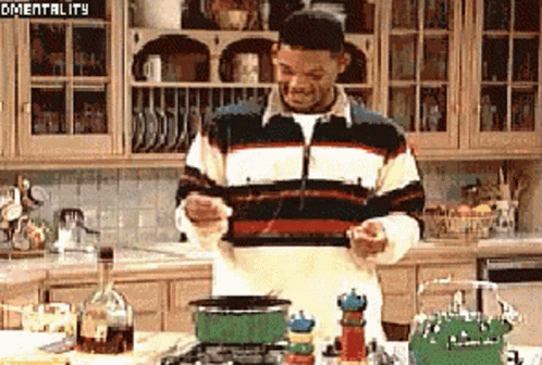 Man in Striped Sweater Cooking in Kitchen Mentality
